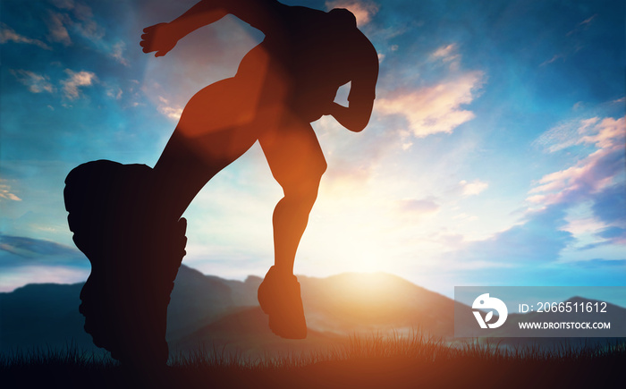 Man running towards the sunset in the mountains