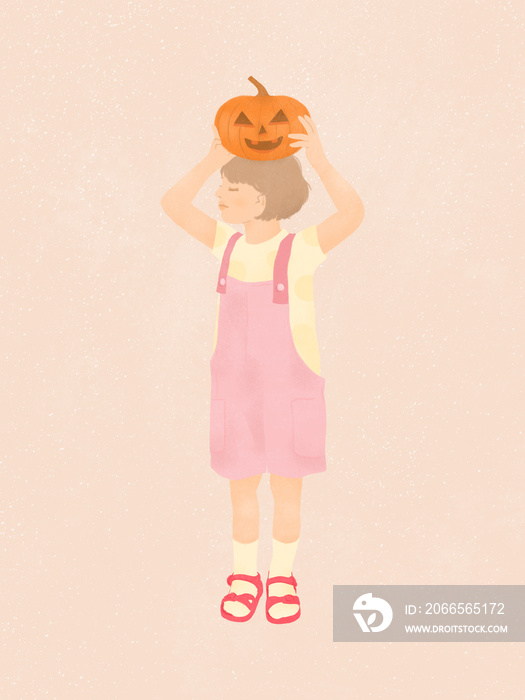 cute smiling little girl holding a Halloween pumpkin