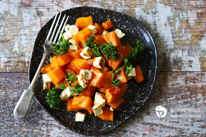 Autumn pumpkin salad with feta and herbs. Keto salad. Keto diet. Healthy vegetarian salad.