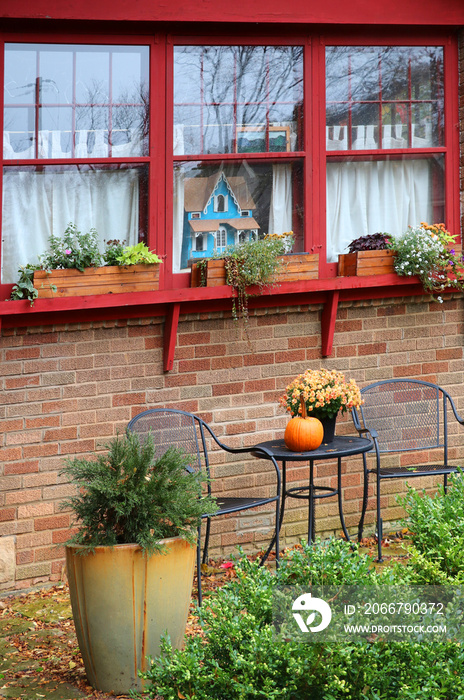 Seasonal house outdoor decoration. Front yard of the old style brick house decorated for autumn holi