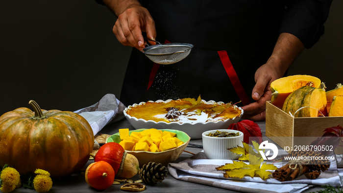 Close the chefs hands sprinkles powdered, ready decorates cakes. Food concept. Flat lay top view