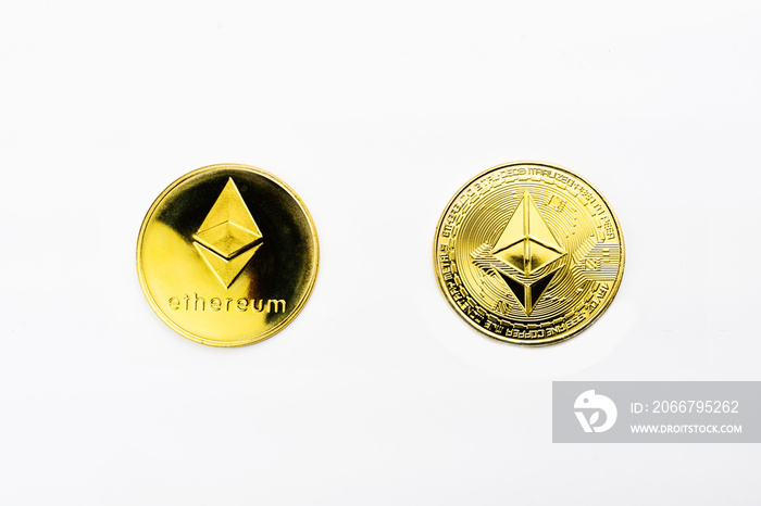 Closeup of a golden Ethereum coin with white background. Cryptocurrency coin. Financial market