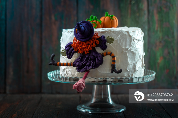 Cake with a witch and pumpkins