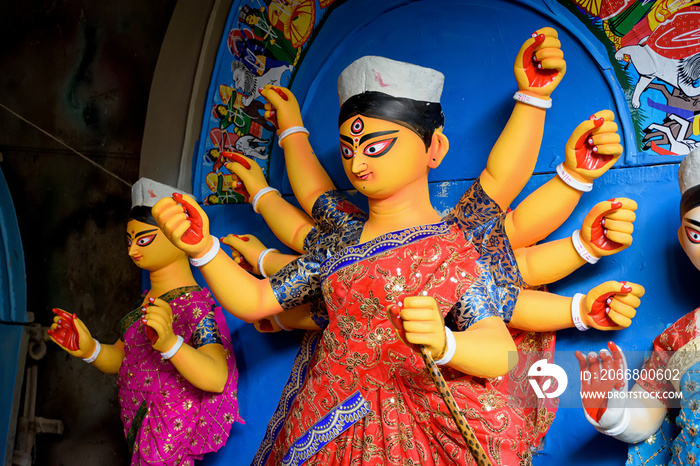 Clay idol of Goddess Devi Durga is in preparation for the upcoming Durga Puja festival at a pottery studio in Kolkata, West Bengal, India.