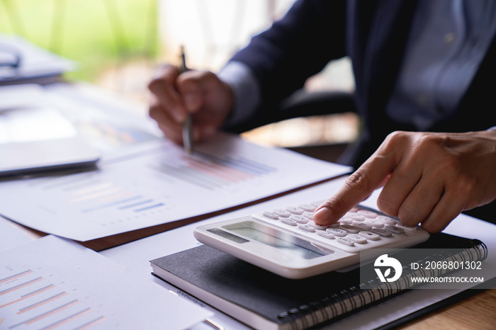 business woman using calculator, renter checking bills, planning budget, sitting at desk with financial documents and receipts, accounting expenses, calculating money, rent or mortgage payment