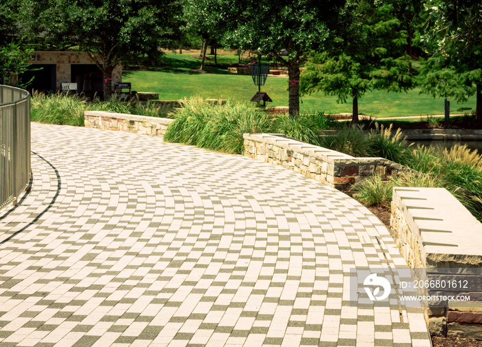 brick pathway near waterway in the Woodlands, TX.