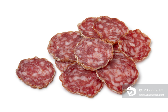 Heap of sliced Rosette de Lyon, a French pork saucisson close up isolated on white background