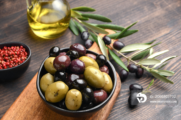 Mixed green olives and black olives with olive oil, healthy eating antioxidants