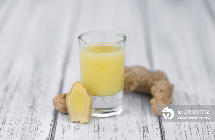 Some fresh Ginger Drink (selective focus; close-up shot)