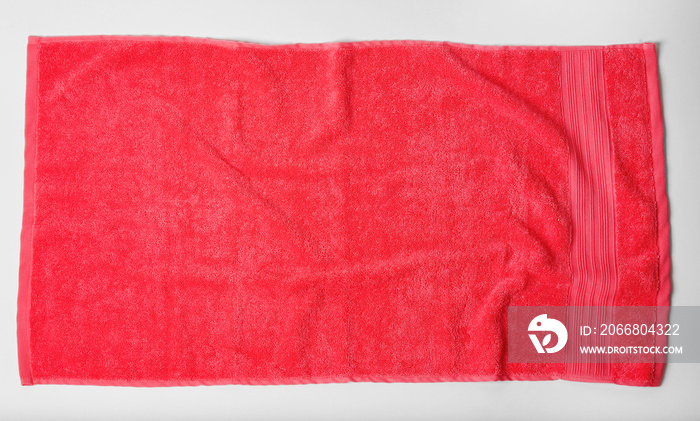 Soft terry towel on light background, top view