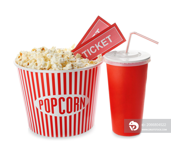 Cup with popcorn, soda and cinema tickets on white background