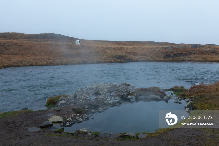 Natural geothermal pool next to Reykjafoss waterfall in iceland