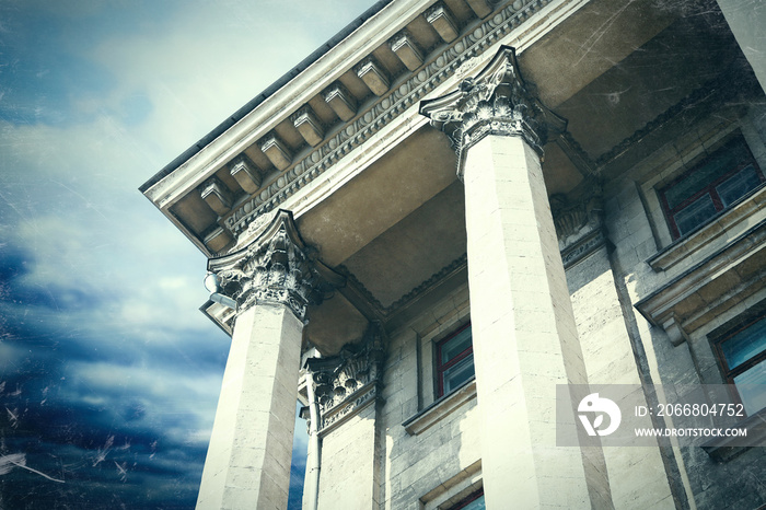 Courthouse facade with columns. Vintage style filter