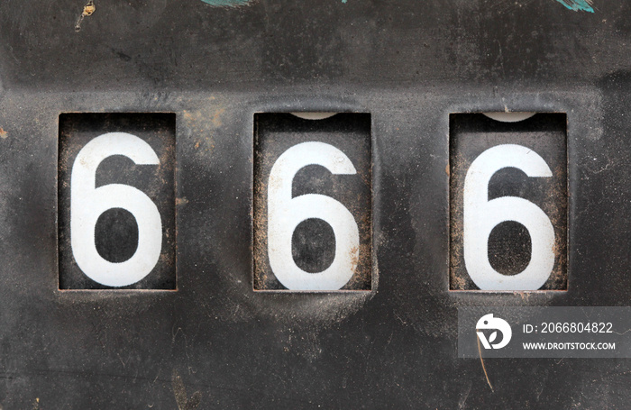 number 666 on old rusty counter of fuel pump