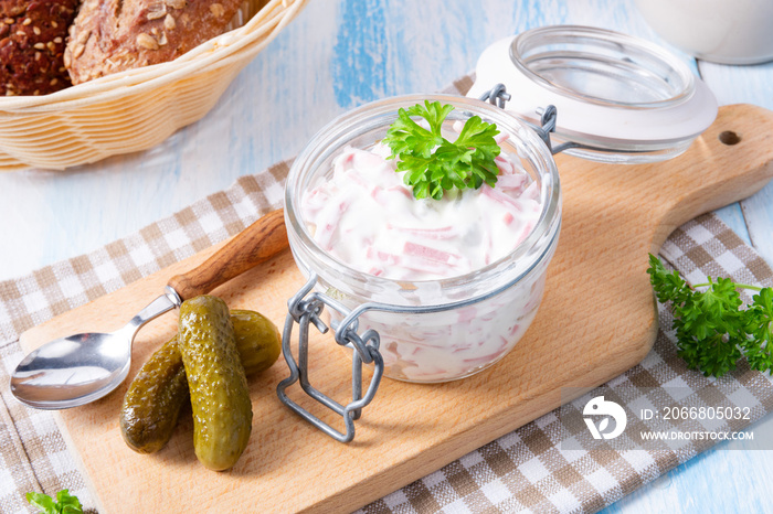 delicious homemade meat salad with mayonnaise and cucumber