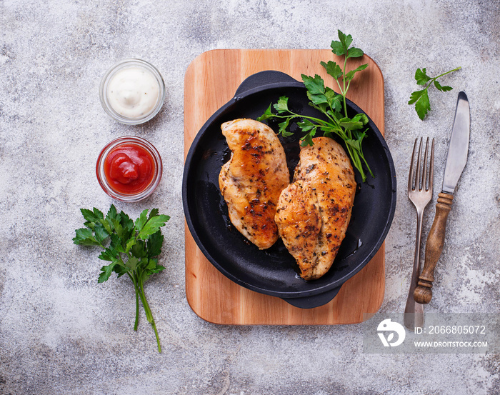 Grilled chicken breast or fillet on iron pan