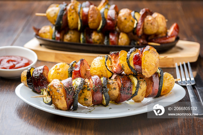 Potato skewers with sausage and zucchini