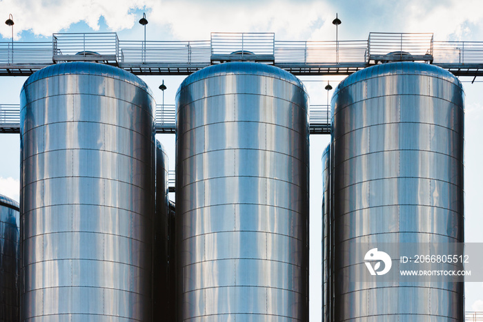 Beer production industry plant. Large amount of fermentation tanks.