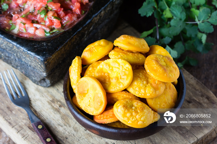 Latin American food. Traditional chilenian homemade pumpkin sopaipillas with salsa