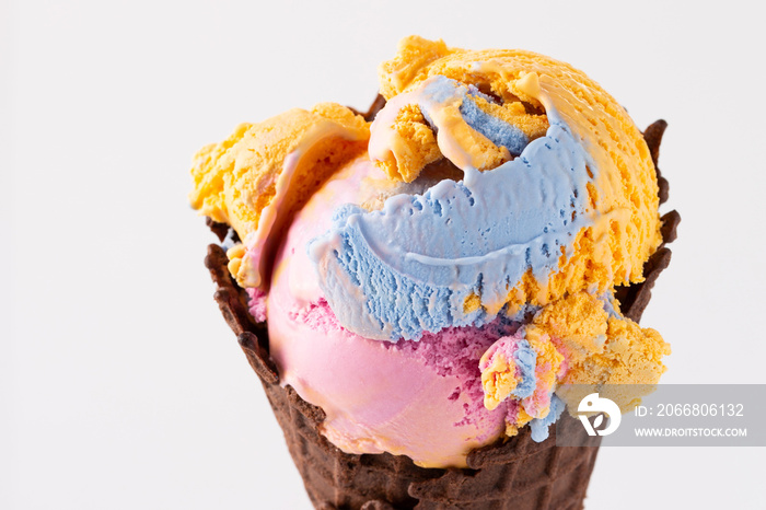 Colorful cotton candy ice cream in waffle cone