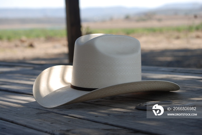 straw hat on a wooden table