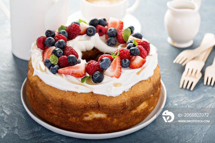 Angel food cake with whipped cream and berries