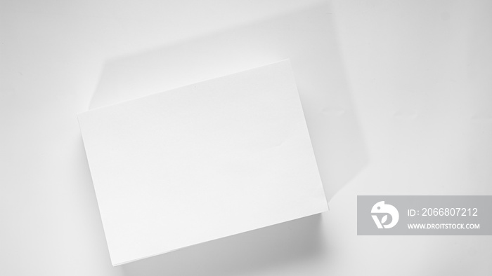 Stack of white office paper on light background, top view, place for text.