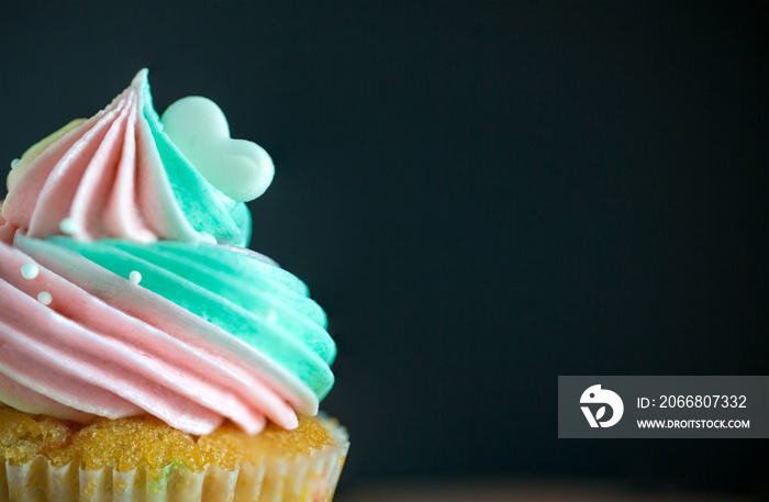 Top view Birthday cupcake on white Background.mini cake. cupcake with rainbow cream and heart for love valentines.image for background,wallpaper and copy space.