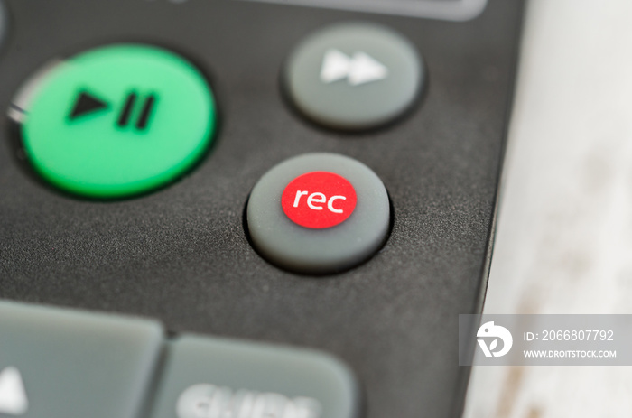 Close up macro photography of a smart tv television remote control with recording button. Concept of show, business, recording, tv, action, and radio