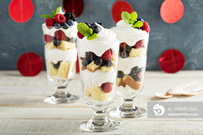 Layered dessert parfait with sweet bread and berries