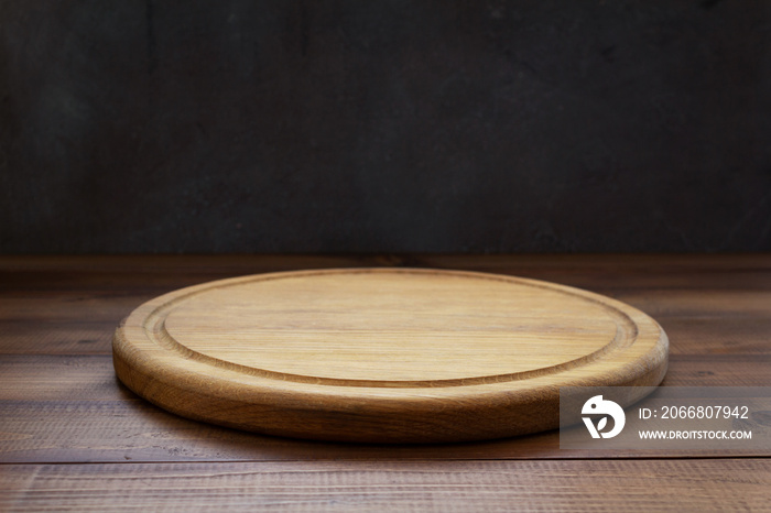 pizza cutting board at wooden table