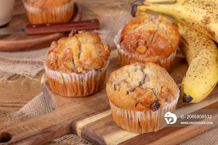 Banana Nut Muffins on a Wooden Board