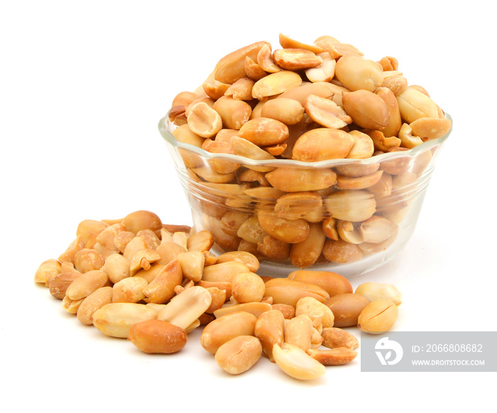 Processed peanuts isolated in glass bowl on white background