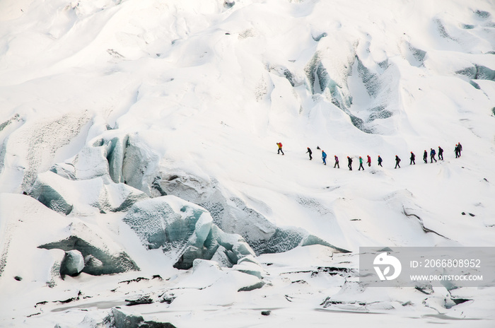 Group of tourists explores Solheimajokul Glacier