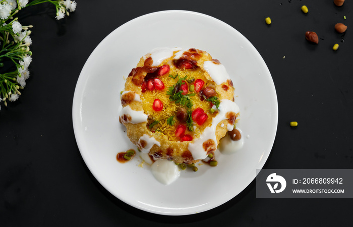 Raj Kachori - popular Indian chaat which crispy fried shells (kachori) filled with potatoes, boiled moong dal, yogurts, spices, chutneys and topped with various garnishes!