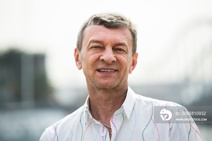 Smiling  mature man posing outdoors