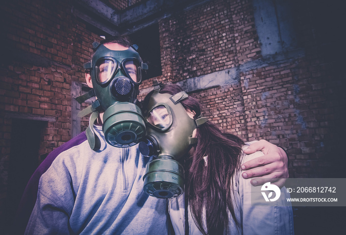 environmental disaster couple in love wearing gas mask