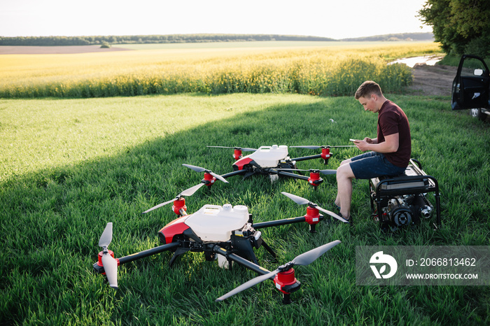 iot smart agriculture industry 4.0 concept, drone (in precision farm) use for spray a water, fertilizer or chemical to the field, farm for growth a yields,crops, use for control, kill the bug or weed