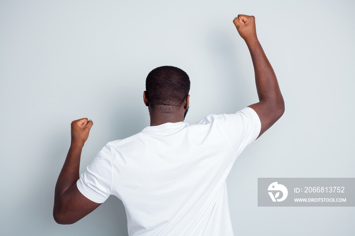 Back rear behind photo of crazy dark skin african guy protester yelling hate police lawlessness raise fists express black people spirit against discrimination isolated grey color background