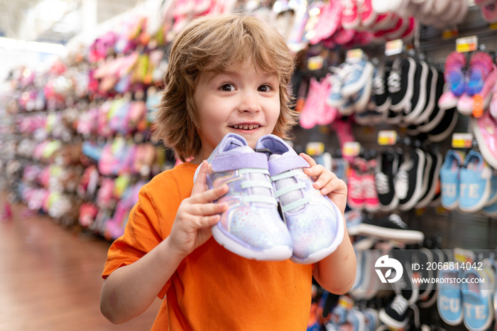 Supermarket, Shopping with Child. Kid in supermarket shoes shop. Sale, consumerism and people concept.