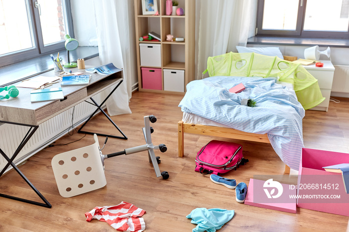 mess, disorder and interior concept - view of messy home kid’s room with scattered stuff