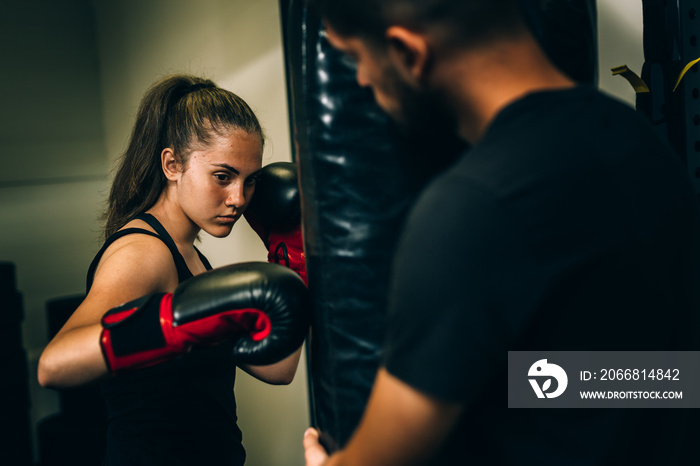 woman kick boxing or boxing training