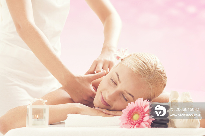 Relaxed woman receiving a back massage