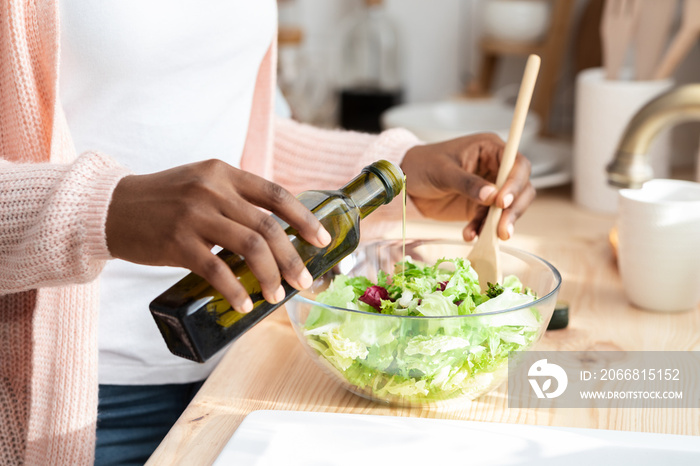 Healthy Nutrition. Unrecognizable Black Woman Cooking Fresh Vegetable Salad In Kitchen