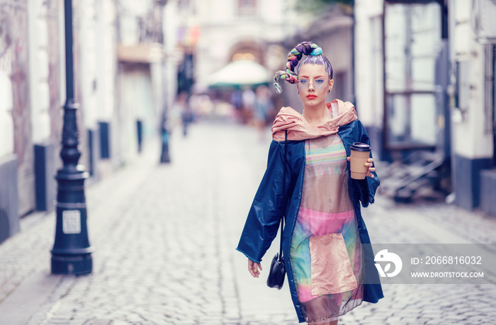 Single young teenage female with extravagant look on streets. Crazy appearance on boulevard. Avant-garde fashion concept