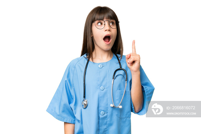 Little girl as a surgeon doctor over isolated chroma key background thinking an idea pointing the finger up