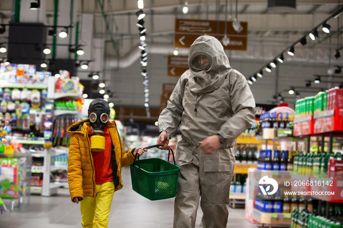 Coronovirus protection. A child in a gas mask and a man in a chemical protection suit in a store. People shop for infection 19.Coronavirus and panic buying concept