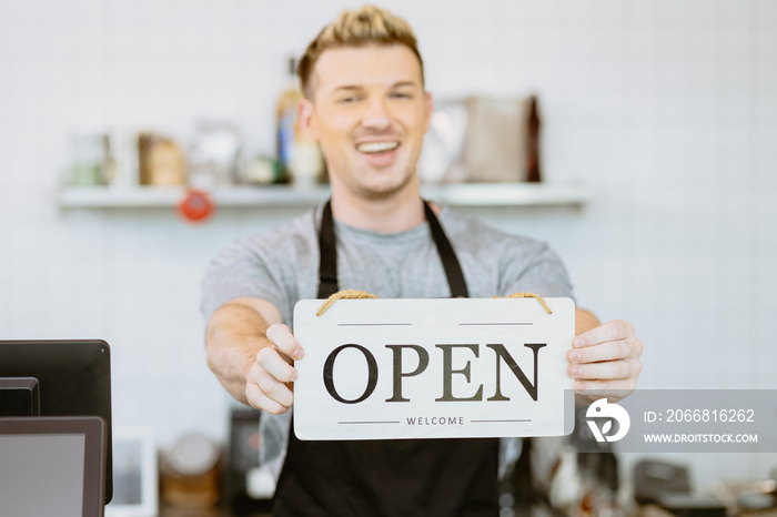 Barista cafe coffee staff hand holding shop Opening sign banner, Restaurant reopen after Covid lockdown concept