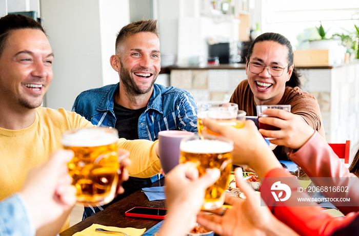 Happy friends toasting draft beer and hot coffee during lunch - Group of smiling boys eating english breakfast in a pub - Friendship concept with happy colleagues celebrate after work