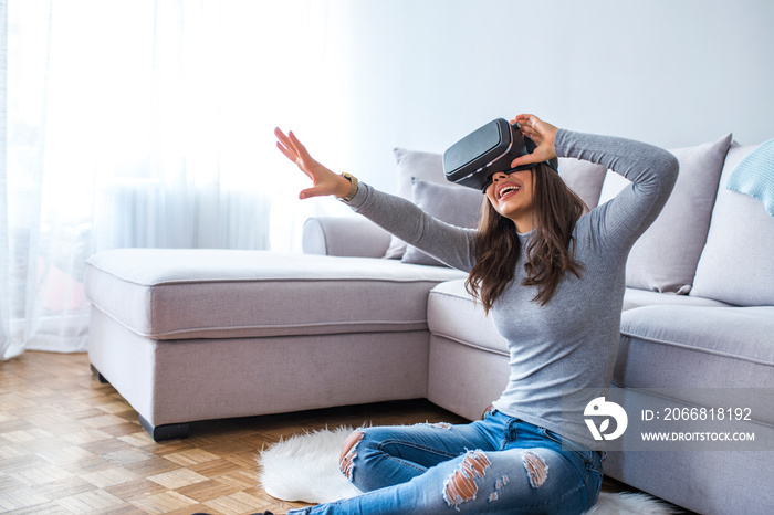 Young woman experiencing immersive virtual reality technology wearing VR glasses, interacting with 360 degrees headset user interface, choosing goods while shopping, selects content in 3d gaming menu